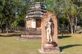 Prang tower and sculpture of a deity next to Wat Traphang Ngoen in the Historical Park of Sukhothai, Thailand, Asia Royalty Free Stock Photo