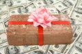 Prank gift and dollars Royalty Free Stock Photo