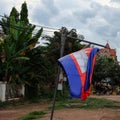 Prapor cambodia swaying in the wind, an overcast evening in south east asia