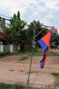 Prapor cambodia swaying in the wind, an overcast evening in south east asia