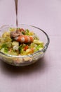 Prawn cocktail with lettuce, pink sauce, crab sticks, pineapple, apple. Glass bowl. A fresh, healthy, vegan and very healthy Royalty Free Stock Photo