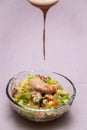 Prawn cocktail with lettuce, pink sauce, crab sticks, pineapple, apple. Glass bowl. A fresh, healthy, vegan and very healthy Royalty Free Stock Photo