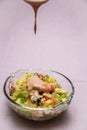 Prawn cocktail with lettuce, pink sauce, crab sticks, pineapple, apple. Glass bowl. A fresh, healthy, vegan and very healthy Royalty Free Stock Photo