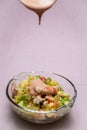 Prawn cocktail with lettuce, pink sauce, crab sticks, pineapple, apple. Glass bowl. A fresh, healthy, vegan and very healthy Royalty Free Stock Photo