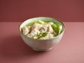 Prawn Dumpling soup with chopsticks served in a bowl isolated on mat side view on grey background