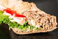 Prawn sandwich on black plate horizontal