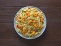 Prawn Schezwan Noodles with vegetables in a plate