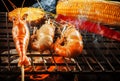 prawn ,shrimp grilled on barbe-que fire stove with pineapple ,red chilly and corn Royalty Free Stock Photo