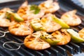 prawn skewers with lime on electric grill Royalty Free Stock Photo