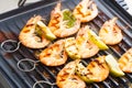 prawn skewers with lime on electric grill Royalty Free Stock Photo