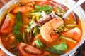 Prawn soup, Spicy soup with shrimp seafood coconut milk and chili pepper in pot, Hot and sour curry shrimps and squid Thai food Royalty Free Stock Photo