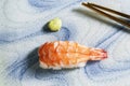 Japanese food prawn sushi on plate has chopstick