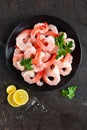 Prawns on plate. Shrimps, prawns. Seafood. Top view. Dark background Royalty Free Stock Photo