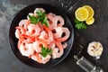 Prawns on plate. Shrimps, prawns. Seafood. Top view. Dark background