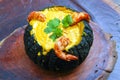 Prawns in Pumpkin Camarao na Moranga - Prawns with a creamy coconut milk sauce served inside a roasted pumpkin