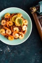 Prawns roasted on grill and boiled brown rice on plate. Grilled shrimps, prawns with rice. Seafood. Asian cuisine. Top view Royalty Free Stock Photo