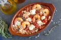 Grilled shrimps covered with feta cheese, tomatosauce