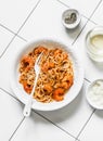 Prawns tomato sauce spaghetti and white wine on a light background, top view Royalty Free Stock Photo