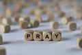 Pray - cube with letters, sign with wooden cubes Royalty Free Stock Photo