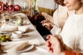 Happy family celebrate Thanksgiving day, sitting at table with roasted turkey and holiday traditional food, dishes. Royalty Free Stock Photo