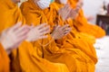 Pray of monks on ceremony of buddhist in Thailand. Many Buddha monk sit on the red carpet prepare to pray and doing Buddhist cerem