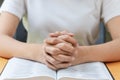 Pray and religion concept, Female christian hands folded and read bible to praying for spirituality Royalty Free Stock Photo