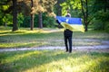 Pray for Ukraine. boy with Ukrainian flag running the summer park. Little kid waving national flag praying for peace. Happy child Royalty Free Stock Photo