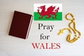 Pray for Wales. Rosary and Holy Bible background