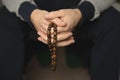 Prayer beads for meditation in men`s hands. Peace, awareness and mindfulness