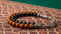 Prayer Beads on Ornate Fabric Royalty Free Stock Photo