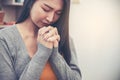 Prayer and bible concept.Asian female praying,hope for peace and free from coronavirus,Hand in hand together by woman,believes and Royalty Free Stock Photo