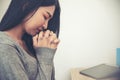 Prayer and bible concept.Asian female praying,hope for peace and free from coronavirus,Hand in hand together by woman, believes Royalty Free Stock Photo