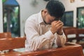 Prayer and bible concept. Asian senior male praying for hope peace and Hand in hand together, believes and faith in christian rel