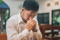 Prayer and bible concept. Asian senior male praying for hope peace and Hand in hand together, believes and faith in christian rel