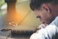 Prayer and bible concept. Caucasian man praying, hope for peace the world and free from coronavirus, Hand in hand together, Royalty Free Stock Photo