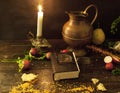 A prayer book and a candle on a dark table. Preparing for Christmas. Religion, Christianity Royalty Free Stock Photo