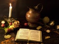 A prayer book and a candle on a dark table. Preparing for Christmas. Religion, Christianity Royalty Free Stock Photo