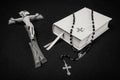 Prayer book, rosary and cross