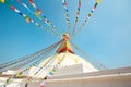 Prayer buddhist flags fluttering in the wind on the Boudhanath stupa in Kathmandu, Nepal Royalty Free Stock Photo