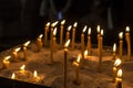 Prayer burning candles in a church on a dark background in St. Stephen`s Cathedral, Vienna. Religious concept Royalty Free Stock Photo