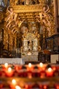 Prayer candles and the ornate interior of Cathedral de Santiago de Compostela Royalty Free Stock Photo
