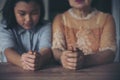 Prayer concept. Asian senior woman and Thai child praying, hope for peace the world and free from coronavirus, Hand in hand Royalty Free Stock Photo