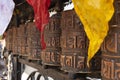 Buddhist prayer drums with close-up mantras and colored flags. Royalty Free Stock Photo