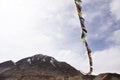 Prayer flag for blessing at viewpoint of Confluence of the Indus and Zanskar Rivers while winter season at Leh Ladakh in India Royalty Free Stock Photo