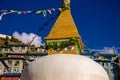 Prayer flags on big stupa with buddha eyes in Nepal in Namche Bazar village Royalty Free Stock Photo