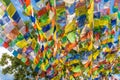 Prayer flags on big stupa with buddha eyes in Nepal Royalty Free Stock Photo