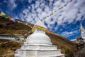 Prayer flags on big stupa with buddha eyes in Nepal on the way to Ama Dablam mountain Royalty Free Stock Photo