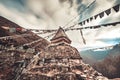 Prayer flags and buddhist stupa on trekking route