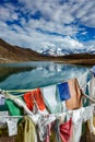 Prayer flags and Dhankar Lake. Spiti Valley, Himachal Pradesh, India