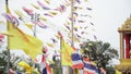 Prayer flags and Flag of Thailand and Royal Flags of Thailand at Temple